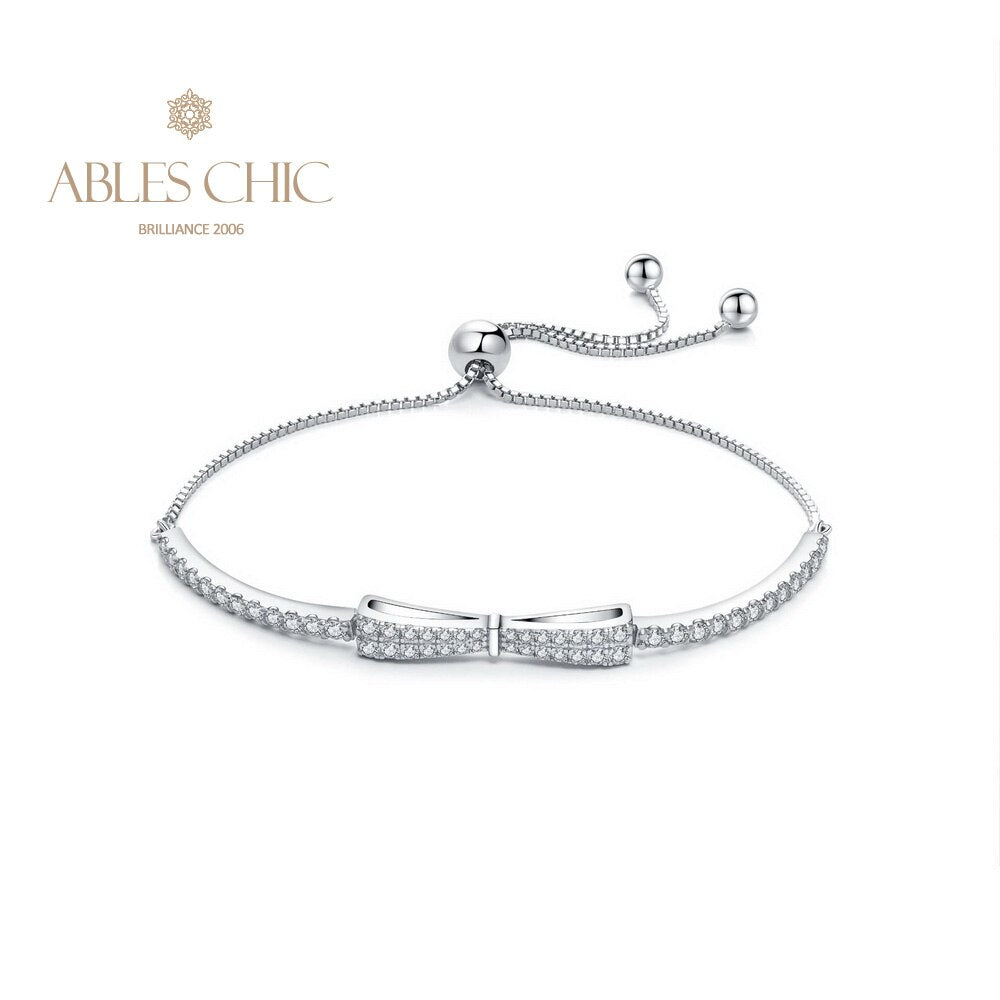 Armband mit gepflasterter Fliege und Bling-Bling-Anhänger B0823